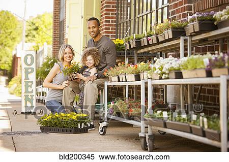 Family at florist shop View Large Photo Image Stock Photography - Family at florist shop. Fotosearch