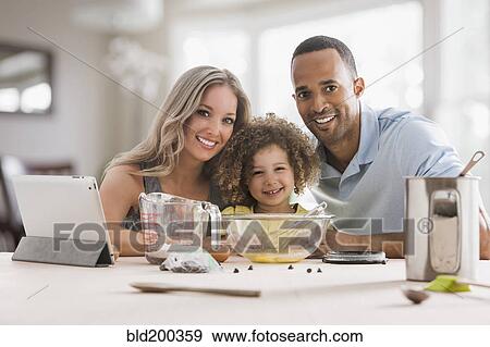 Stock Photo - Family baking together. Fotosearch