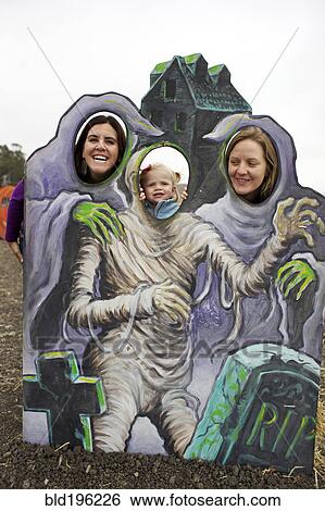 Family enjoying Halloween decoration View Large Photo Image Stock Photograph - Family enjoying Halloween decoration. Fotosearch