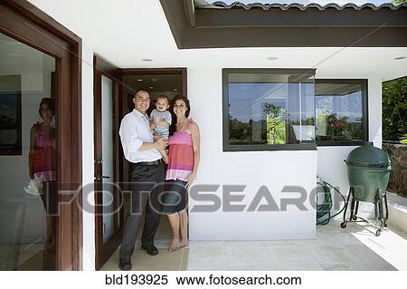 Family smiling on patio View Large Photo Image Stock Photography - Family smiling on patio. Fotosearch