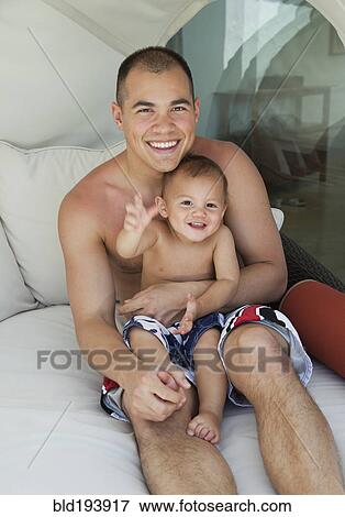 Father holding son on lap View Large Photo Image Stock Photo - Father holding son on lap. Fotosearch