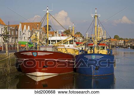 Stock Photo - Fishing boats moored in harbor. Fotosearch