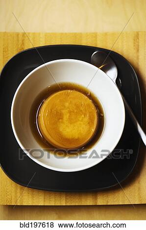 Flan dessert in bowl View Large Photo Image Stock Photo - Flan dessert in bowl. Fotosearch
