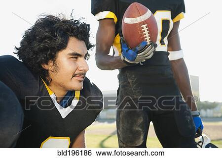 Football players together on football field View Large Photo Image Stock Photograph - Football players together on football field. Fotosearch