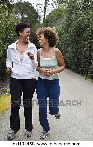 Friends exercising outdoors View Large Photo Image Stock Photo - Friends exercising outdoors. Fotosearch