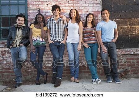 Friends hanging out together in urban area View Large Photo Image Stock Image - Friends hanging out together in urban area. Fotosearch