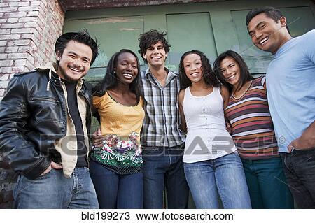 Friends hanging out together in urban area View Large Photo Image Stock Image - Friends hanging out together in urban area. Fotosearch