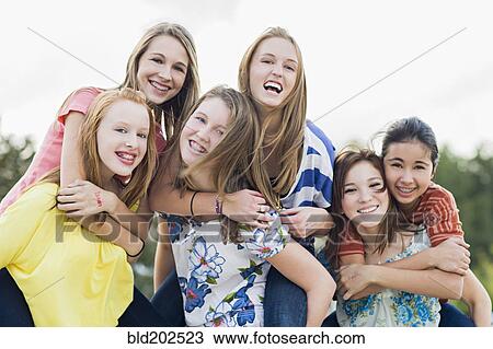 Stock Image - Friends hanging out together. Fotosearch