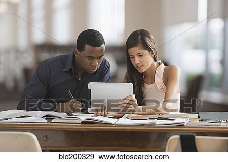 Friends studying with digital tablet View Large Photo Image Stock Photo - Friends studying with digital tablet. Fotosearch