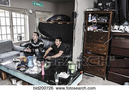 Stock Photograph - Friends watching television together. Fotosearch