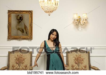 Glamorous Vietnamese woman standing in elegant room View Large Photo Image Stock Image - Glamorous Vietnamese woman standing in elegant room. Fotosearch