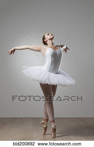 Graceful ballet dancer in tutu View Large Photo Image Stock Image - Graceful ballet dancer in tutu. Fotosearch