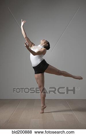 Graceful Caucasian ballet dancer View Large Photo Image Stock Photo - Graceful Caucasian ballet dancer. Fotosearch