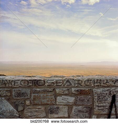 Stock Photo - Graffiti on wall with desert in background. Fotosearch