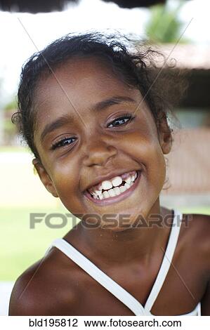 Grinning mixed race girl View Large Photo Image Stock Image - Grinning mixed race girl. Fotosearch