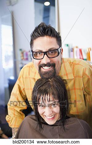 Picture - Hairdresser and client in salon. Fotosearch