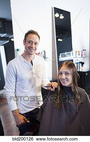 Stock Photograph - Hairdresser and customer in hair salon. Fotosearch