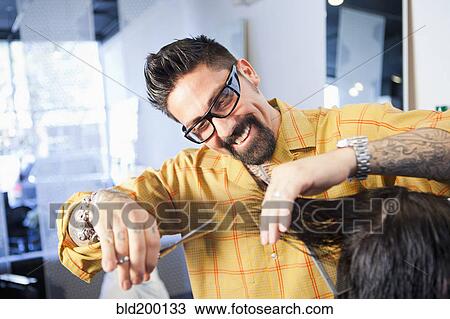 Hairdresser cutting hair in salon View Large Photo Image Stock Image - Hairdresser cutting hair in salon. Fotosearch
