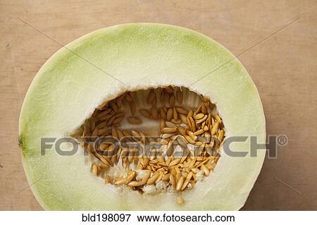 Stock Photo - Half of melon with seeds. Fotosearch