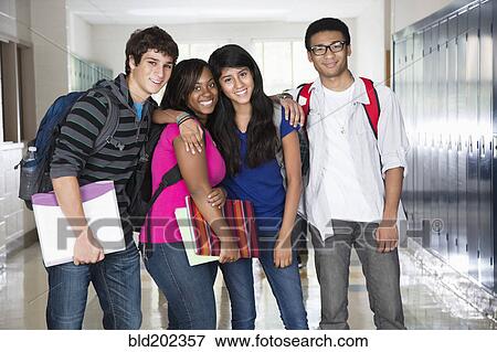 Stock Photo - High school friends standing in corridor together. Fotosearch