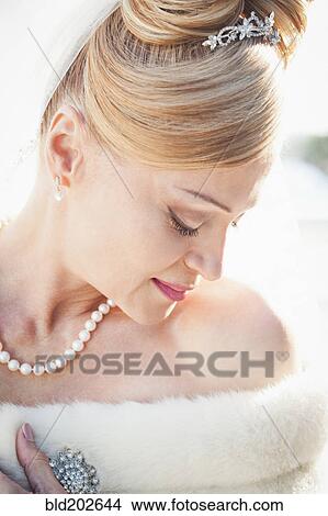 Picture - Hispanic bride looking down. Fotosearch