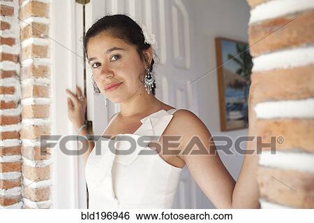 Hispanic bride standing in doorway View Large Photo Image Stock Photograph - Hispanic bride standing in doorway. Fotosearch