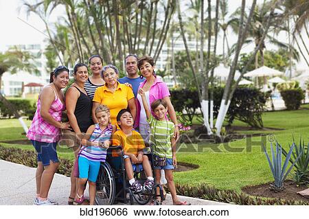 Hispanic family standing together outdoors View Large Photo Image Stock Photograph - Hispanic family standing together outdoors. Fotosearch