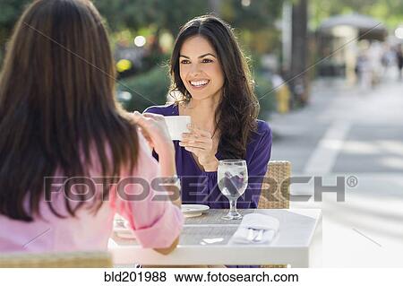 Hispanic friends having lunch together View Large Photo Image Stock Photo - Hispanic friends having lunch together. Fotosearch