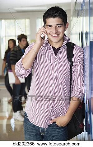 Stock Photograph - Hispanic high school student talking on cell phone. Fotosearch