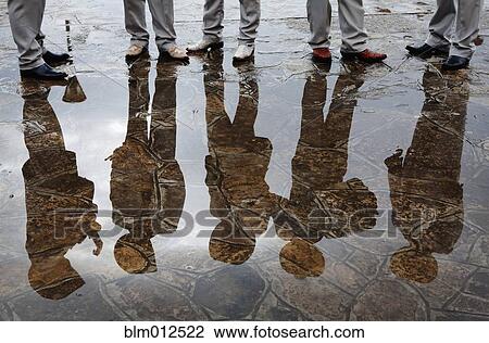 Hispanic Mariachi musicians standing together in puddle View Large Photo Image Stock Image - Hispanic Mariachi musicians standing together in puddle. Fotosearch