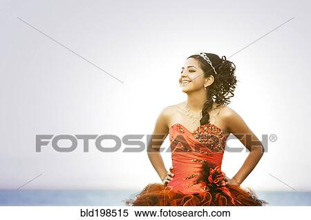 Stock Photography - Hispanic teenager dressed for quinceanera. Fotosearch