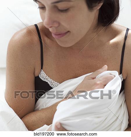 Hispanic woman holding blanket View Large Photo Image Stock Image - Hispanic woman holding blanket. Fotosearch
