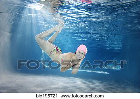 Hispanic woman in bikini swimming underwater View Large Photo Image Stock Image - Hispanic woman in bikini swimming underwater. Fotosearch