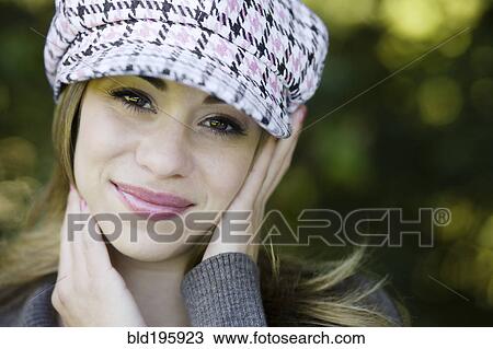 Hispanic woman in fashionable cap View Large Photo Image Stock Image - Hispanic woman in fashionable cap. Fotosearch