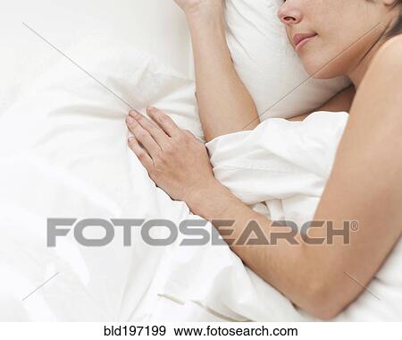 Hispanic woman sleeping in bed View Large Photo Image Stock Photo - Hispanic woman sleeping in bed. Fotosearch