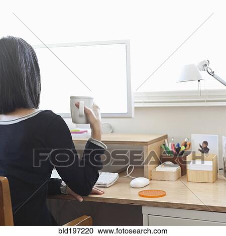 Hispanic woman working in home office View Large Photo Image Stock Image - Hispanic woman working in home office. Fotosearch