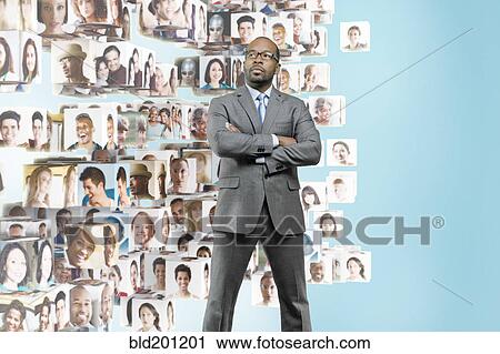 Images of business people behind African American businessman View Large Photo Image Stock Image - Images of business people behind African American businessman. Fotosearch