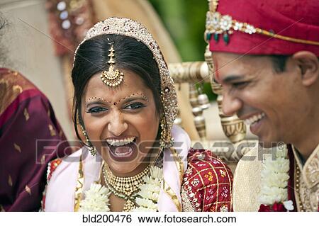 Stock Photograph - Indian bride and groom in traditional clothing. Fotosearch