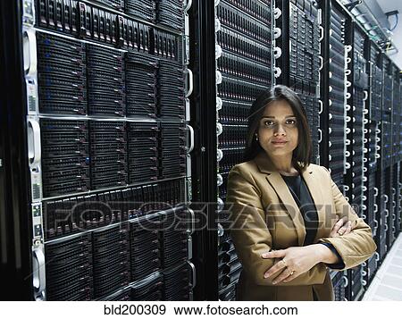 Indian businesswoman standing in server room View Large Photo Image Stock Photo - Indian businesswoman standing in server room. Fotosearch