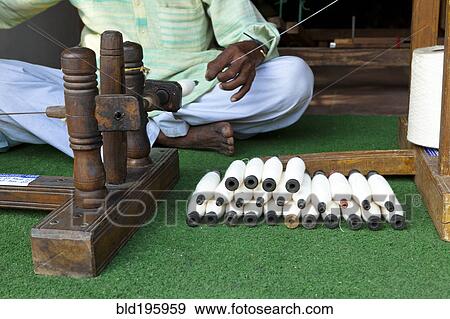 Indian man working with thread View Large Photo Image Stock Photo - Indian man working with thread. Fotosearch