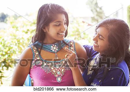 Indian mother and daughter in traditional clothing View Large Photo Image Stock Photograph - Indian mother and daughter in traditional clothing. Fotosearch