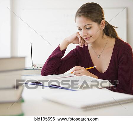 Indian student studying textbook View Large Photo Image Stock Photograph - Indian student studying textbook. Fotosearch