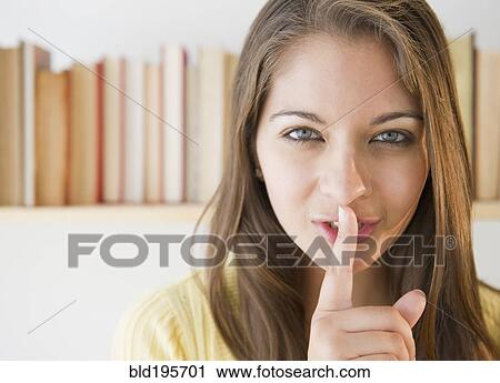 Stock Image - Indian woman making 'shhh' gesture. Fotosearch