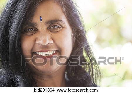Indian woman with jewel on forehead View Large Photo Image Picture - Indian woman with jewel on forehead. Fotosearch