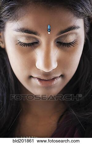 Indian woman with jewel on forehead View Large Photo Image Stock Image - Indian woman with jewel on forehead. Fotosearch