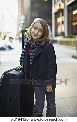 Italian girl with suitcase on urban sidewalk View Large Photo Image Stock Image - Italian girl with suitcase on urban sidewalk. Fotosearch