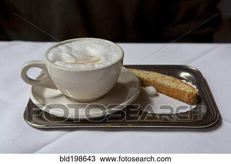 Latte and biscotti on tray View Large Photo Image Stock Image - Latte and biscotti on tray. Fotosearch