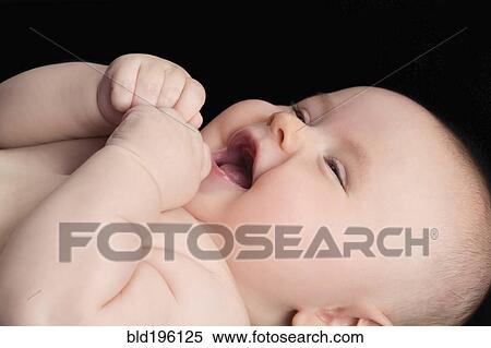 Stock Photography - Laughing Caucasian baby. Fotosearch
