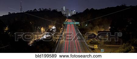 Stock Photo - Long exposure of highway at night. Fotosearch