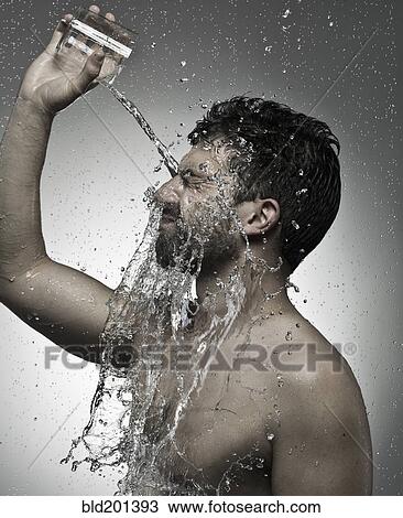 Man pouring water on himself View Large Photo Image Stock Image - Man pouring water on himself. Fotosearch